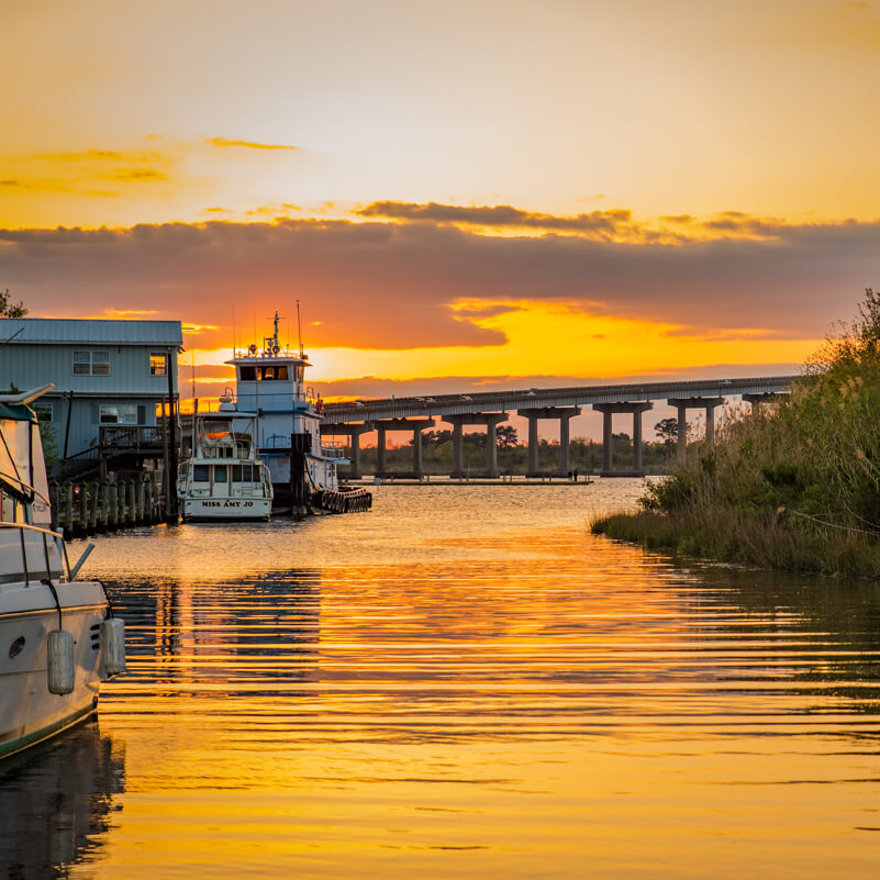 Boats and sunset on river